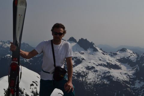 Summer skiing on Vancouver Island.  Summit of 5040 Peak with Triple Peak in the background.  Superb spring conditions but the snow is going fast!