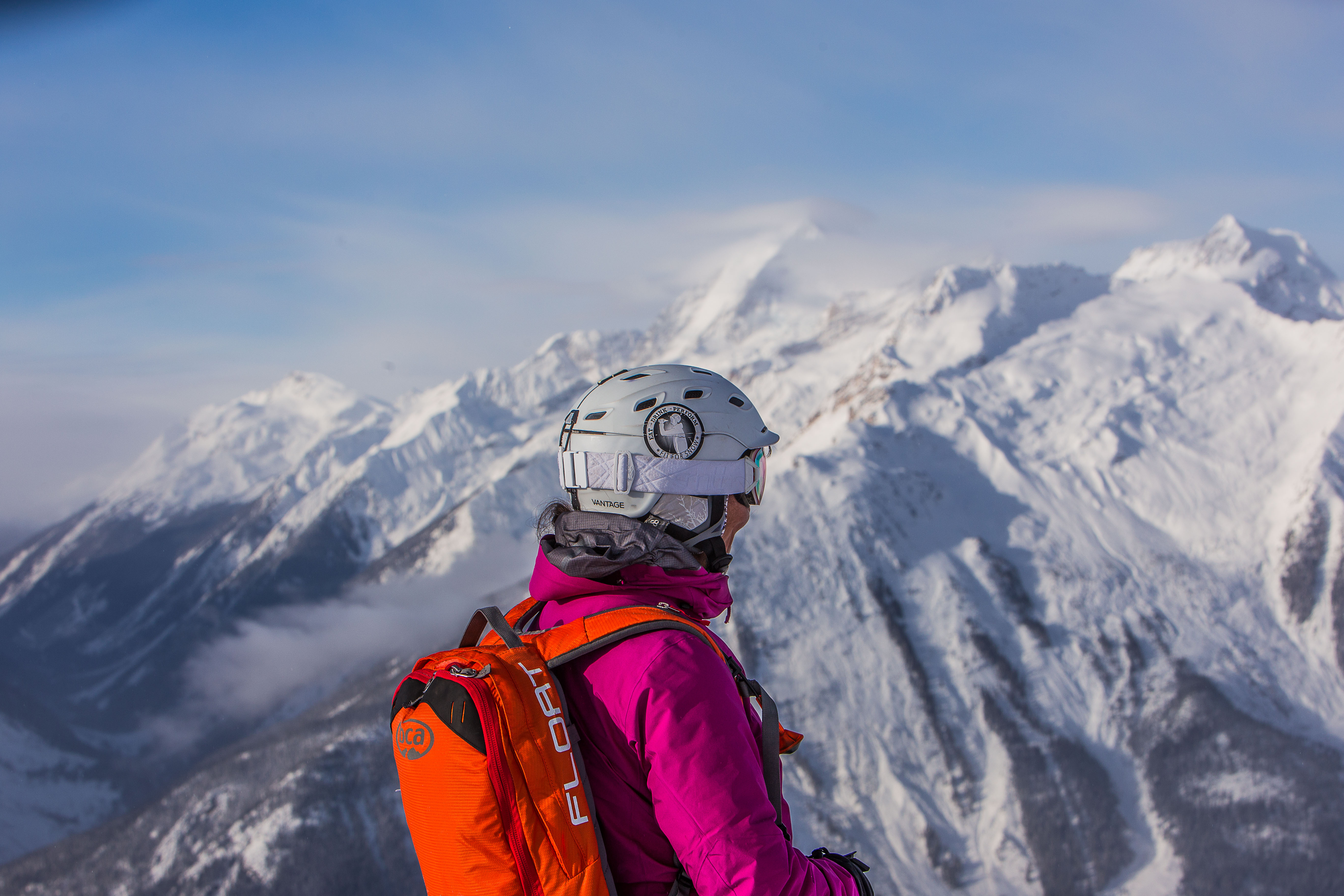 Delia scoping out her line at Great Canadian Heli-Skiing